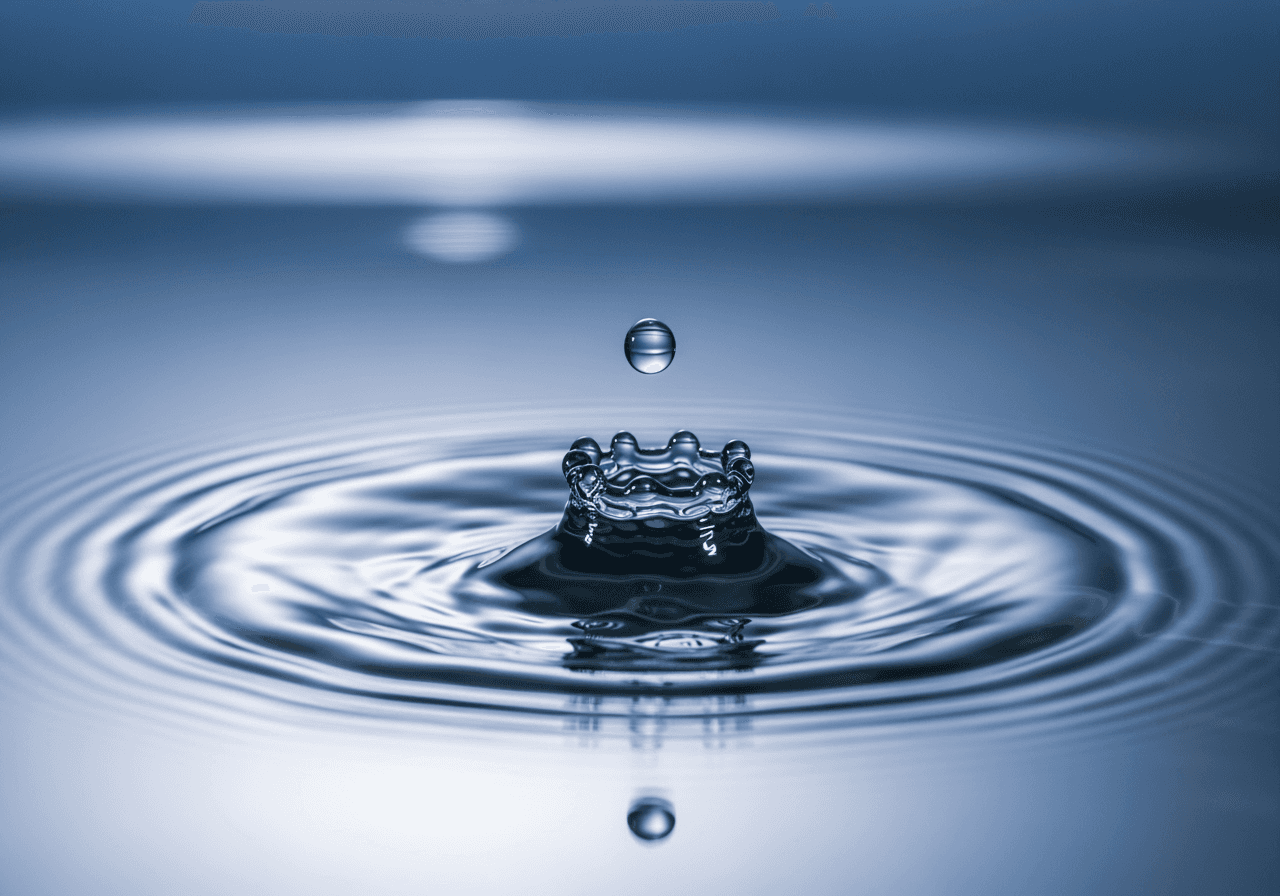 A macro shot of a water droplet splashing, representing realistic AI physics simulation and high-quality video.